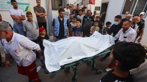 Palestinian workers transfer the bodies of the volunteers from the World Central Kitchen who were killed from an Israeli airstrike, from Al-Najjar Hospital, to Rafah crossing, in the southern Gaza Strip, April 3, 2024. (Mohammed/Flash90)
