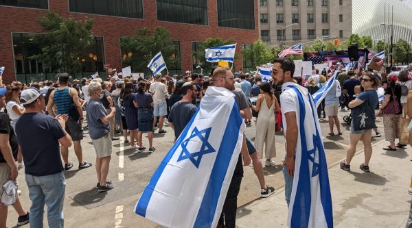 Two men wearing Israeli flags in New York City on May 23, 2021. (Ben Sales/JTA)