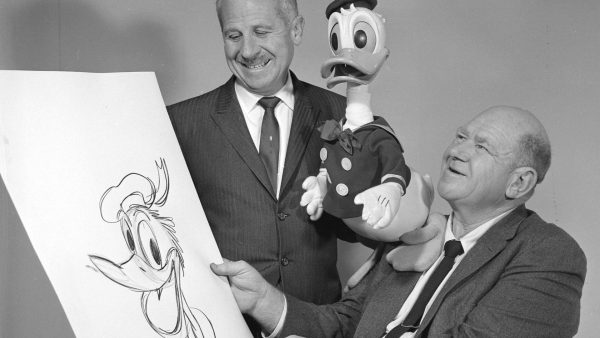 Disney artist and writer Roy Williams, right, with a drawing of Donald Duck. Donalds 25-year-old voice, Clarence \Ducky\ Nash, is pictured with a Donald Duck dummy. Both were in Springfield for the promotion of the feature film 101 Dalmatians. Nl Feb 1961 027 Disney artist and writer Roy Williams, right, with a drawing of Donald Duck. Donalds 25-year-old voice, Clarence \Ducky\ Nash, is pictured with a Donald Duck dummy. Both were in Springfield for the promotion of the feature film 101 Dalmatians.