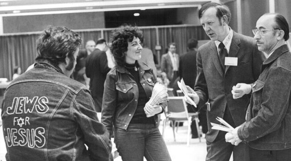 From left are Moishe Rosen (back to camera) and Jean Emma; at right is Eliezer Urbach. The three talk with unidentified man at a meeting of American Baptist Convention in Denver, Colo., on May 12, 1972. (Denver Post via Getty Images)