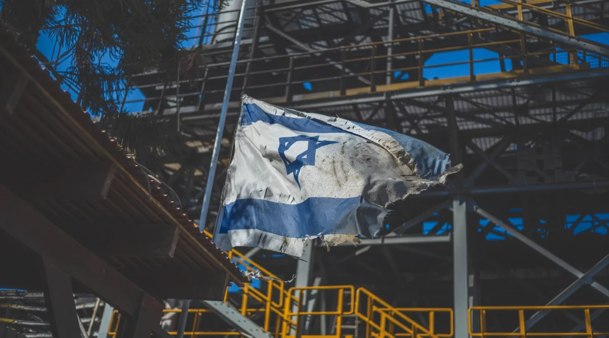 A view of a ripped Israeli flag following the deadly attack by Islamist Hamas militants on Kibbutz Nir Oz, Oct. 19, 2023. (Ilia Yefimovich/picture alliance via Getty Images)