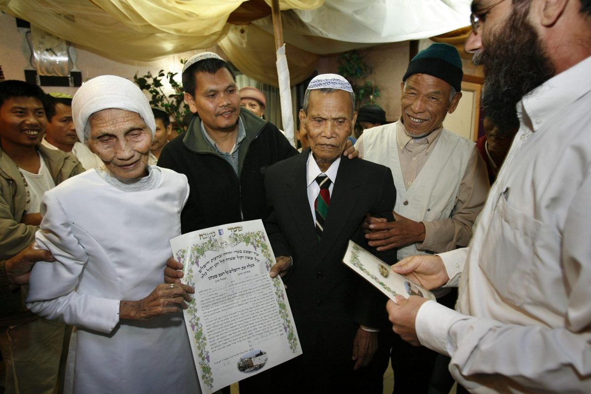 Ora, 84, and Yaakov, 97, Manloon, married Bnei Menashe immigrants from India, hold a “ketubah” marriage contract as they get married according to Jewish law in Kiryat Arba on May 2, 2008. Photo by Michal Fattal/Flash90.

