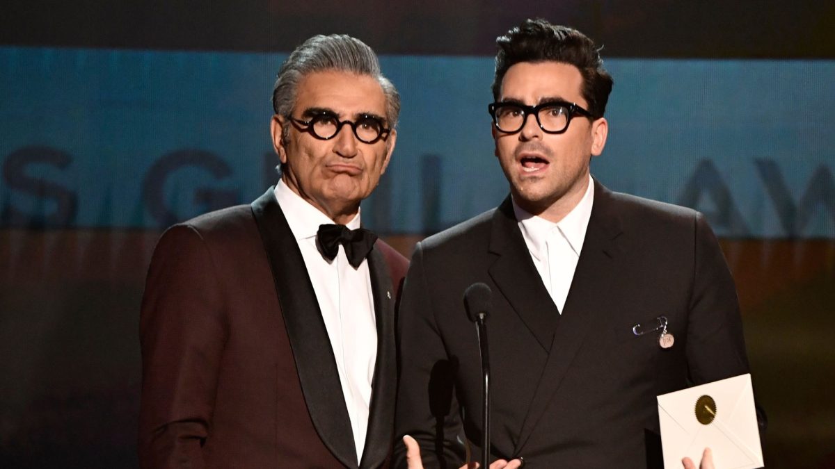 Jan 19, 2020; Los Angeles, CA, USA; Eugene Levy (left) and Dan Levy present the award for outstanding performance by a cast in a motion picture during the 26th Annual Screen Actors Guild Awards at the Shrine Auditorium. Mandatory Credit: Robert Hanashiro-USA TODAY