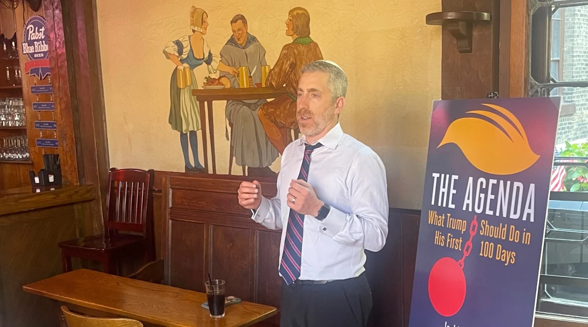 Joel Pollak launches his book, "The Agenda," at a theme tavern at the Republican National Convention in Milwaukee, July 18, 2024. (Ron Kampeas)