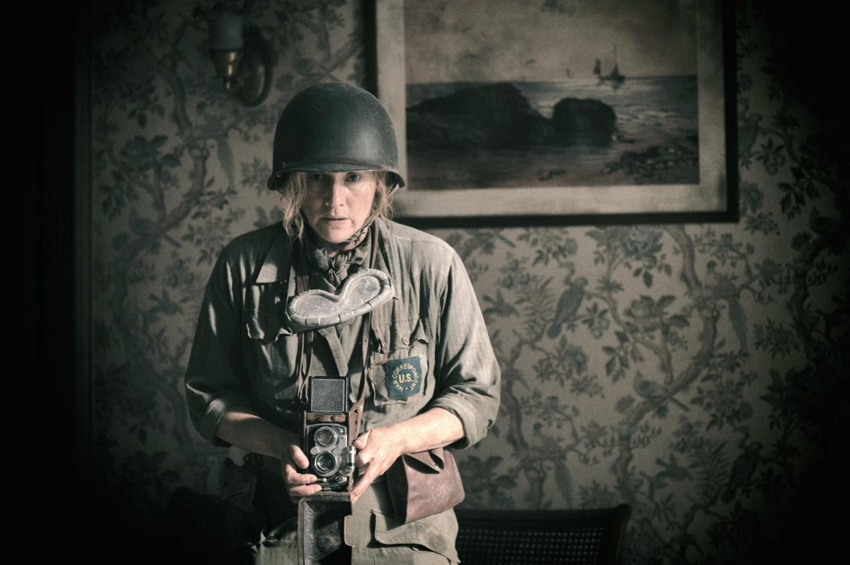 Kate Winslet as Lee Miller, in the biopic ‘Lee.’ After the fall of Nazi Germany, Miller’s images documented the aftermath of the Shoah, taking photos at Dachau and other locations that were published in American publications. 
