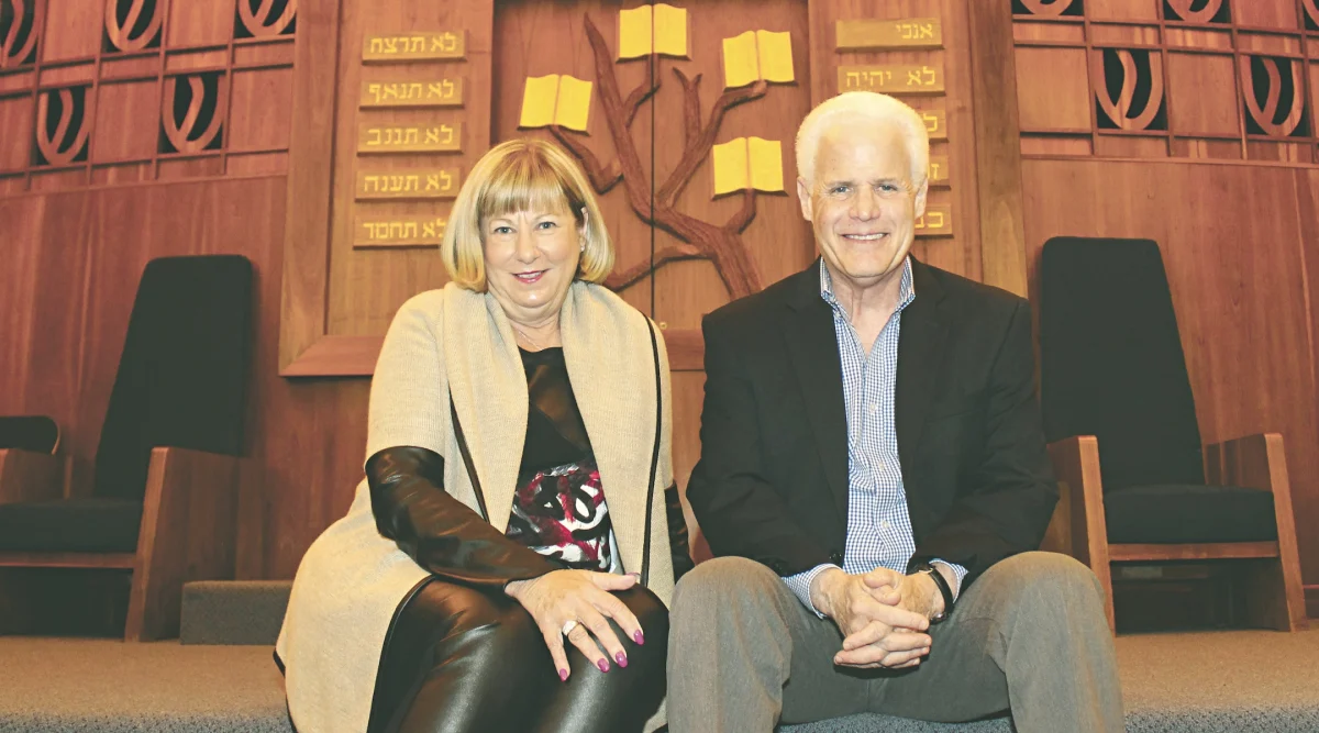 Rabbi Cary Kozberg, right, sits with Temple Sholom President Laurie Leventhal inside the synagogue's Springfield, Ohio, sanctuary in 2016. (Courtesy Dayton Jewish Observer)