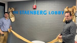 Max Oppenheimer and Max Gornish reveal the signage of the new Staenberg Lobby at Epstein Hebrew Academy on Monday, Nov. 25 at a dedication ceremony. 