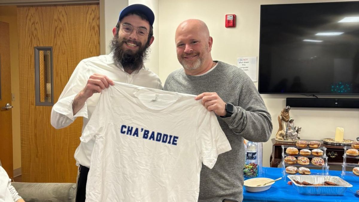 Rabbi Yankel Oster and Head coach Josh Schertz of the Saint Louis University Billikens men's basketball team.