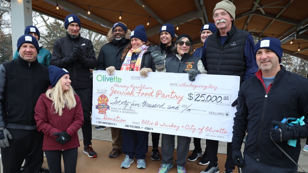 Olivette Mayor Missy Waldman (center) presents a check to JFS and the Harvey Kornblum Jewish Food Pantry
