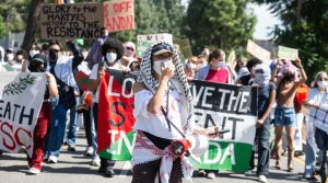 On the anniversary of the Hamas attack on Israel, USC students walk out of class and march around their campus in support of Palestinians and the divest movement on Monday, October 7, 2024 in Los Angeles. President Trump's executive order on Jan. 29, 2025, suggests that foreign-born protesters who express support for terrorism be deported. (Sarah Reingewirtz, Los Angeles Daily News/SCNG)