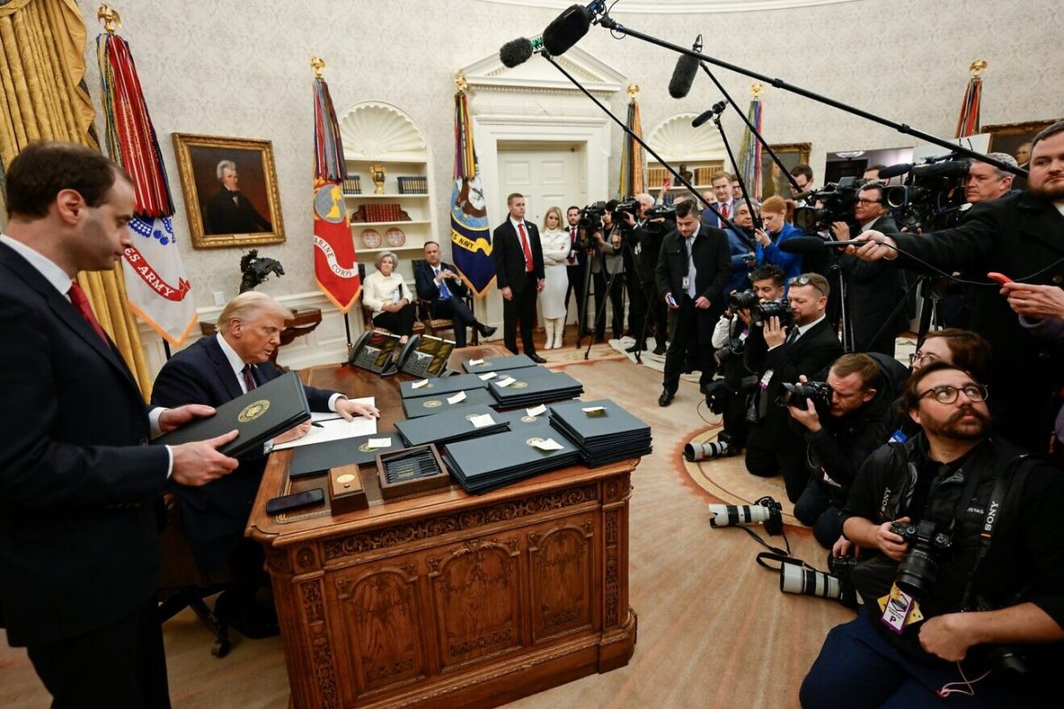 U.S. President Donald Trump signs executive orders on the first day of his second term, Jan. 20, 2025. Credit: White House.