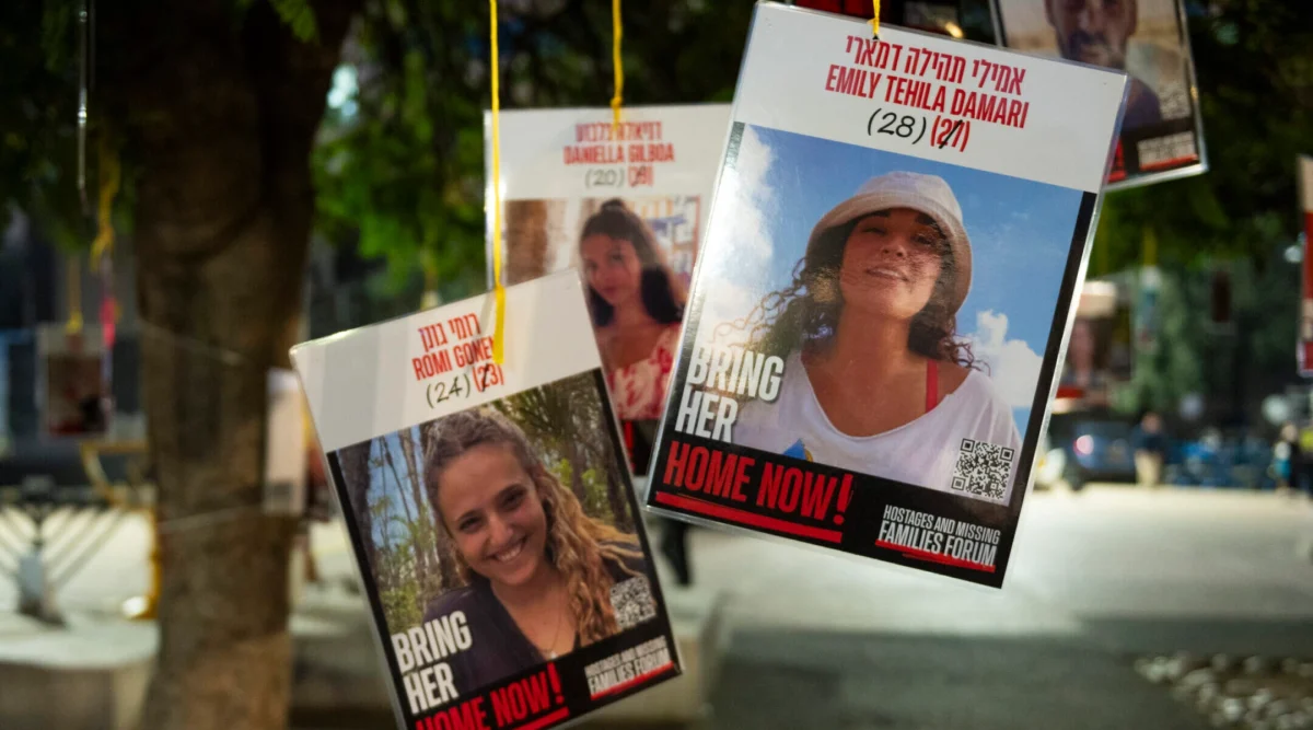 Posters of hostages Emily Damari and Romi Gonen, two of the first hostages Hamas said it would release from Gaza, are displayed at Tel Aviv's Hostage Square, Jan. 16, 2025.