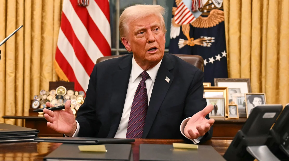 US President Donald Trump speaks to journalists in the Oval Office on January 20, 2025. 