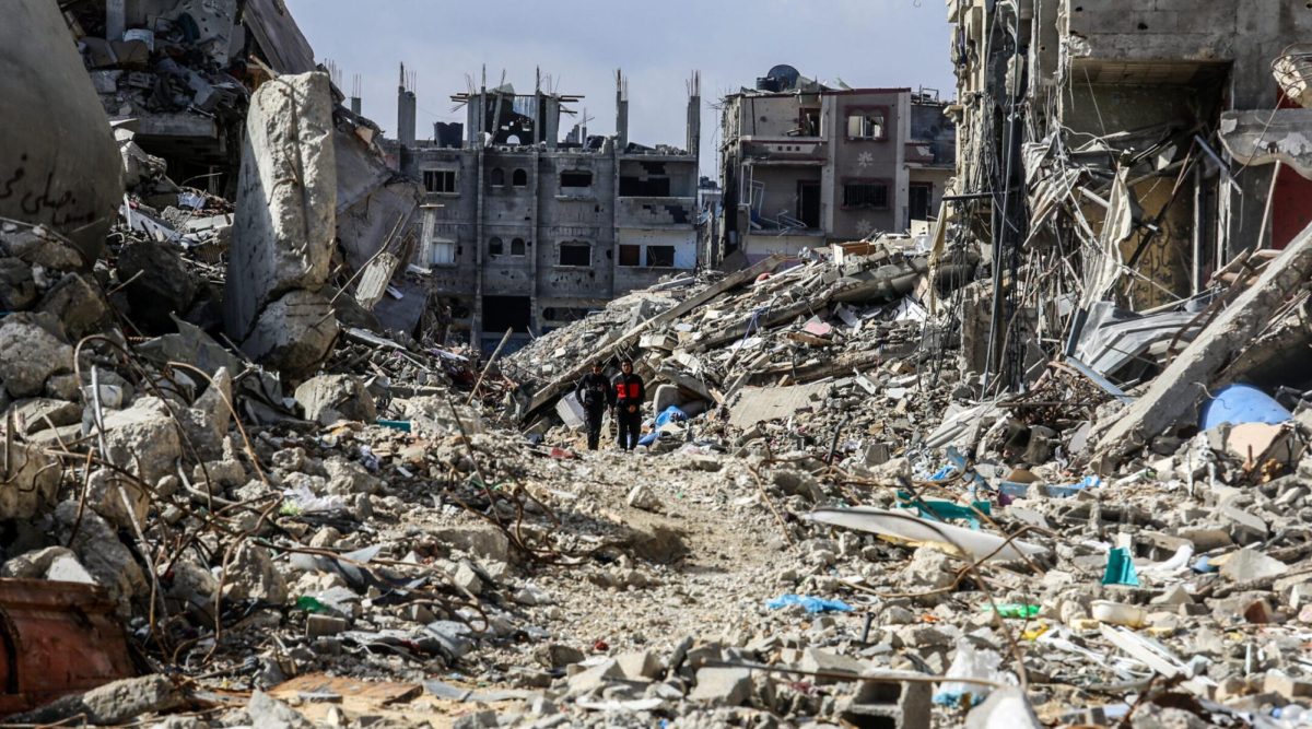 Palestinians walk along destroyed houses at the Shaboura area in the center of Rafah, days into the ceasefire agreement between Israel and Hamas, Jan 24, 2025.(Abed Rahim Khatib/dpa  via Getty Images)