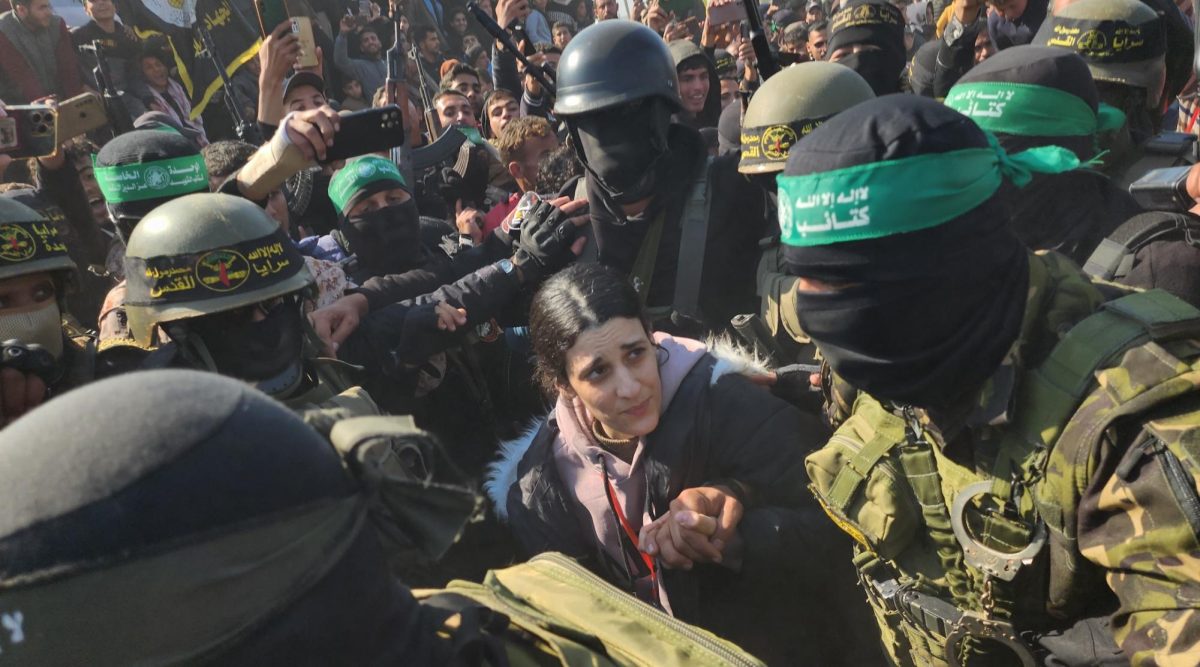 Arbel Yehud, an Israeli hostage held in Gaza, is made to traverse a dense crowd of terrorists before being handed over to the Red Cross outside Yahya Sinwar's house in Khan Yunis, Gaza, Jan. 30, 2025. (Hani Alshaer/Anadolu via Getty Images)