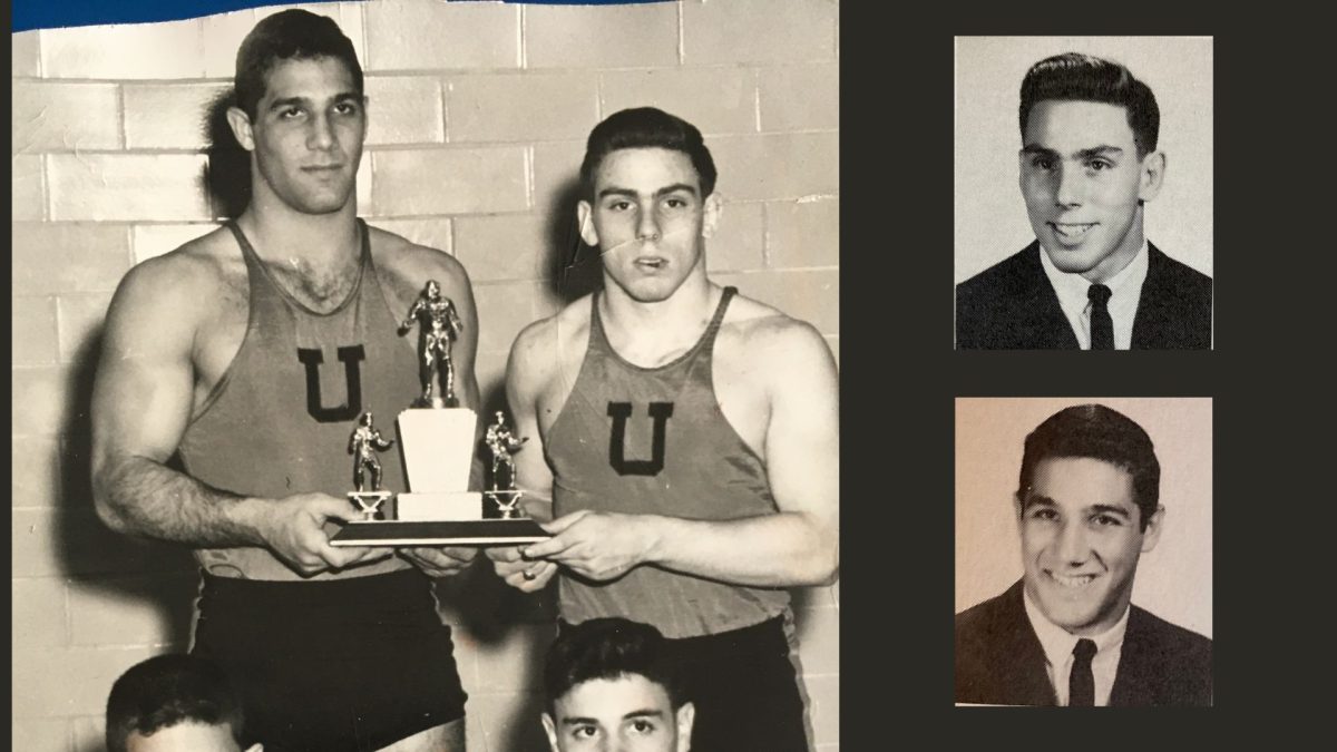 Then-University City High School students Bernie Steinberg and Myron Kinberg hold the state wrestling trophy. 