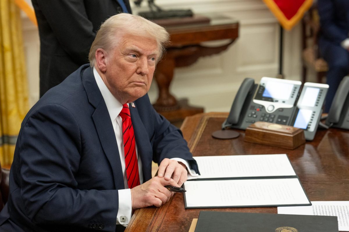 U.S. President Donald Trump signs executive orders in the Oval Office, Feb. 10, 2025. Credit: Daniel Torok/White House.