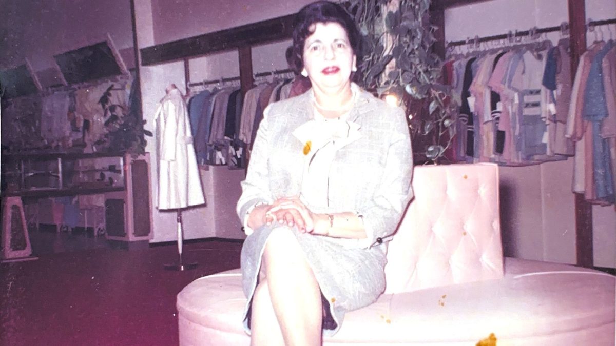 Adeline Mass, on her store's iconic pink couch. 