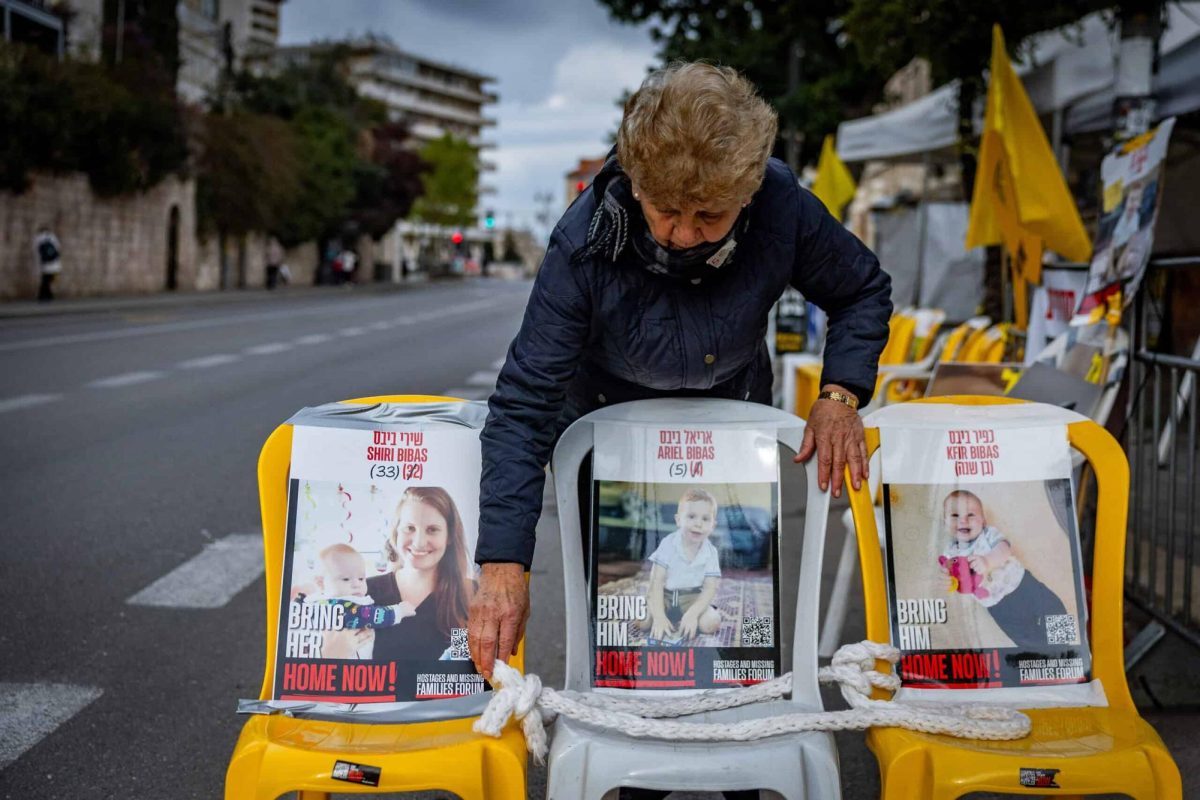 Pictures of Shiri Bibas and her children Kfir and Ariel who are held hostage in Hamas captivity hang outside the protest tent calling for the release of Israeli hostages in the Gaza Strip, outside the Prime Minister’s Residence in Jerusalem, Feb. 19, 2025. 