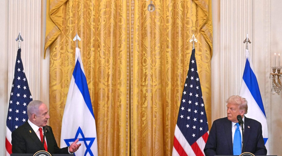 US President Donald Trump listens to Israel's Prime Minister Benjamin Netanyahu speak during a press conference in the East Room of the White House in Washington, DC, Feb. 4, 2025. 