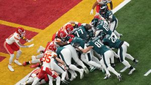 Feb 9, 2025; New Orleans, LA, USA; Philadelphia Eagles quarterback Jalen Hurts (1) rushes the ball for a touchdown against the Kansas City Chiefs during the first quarter in Super Bowl LIX at Caesars Superdome. 