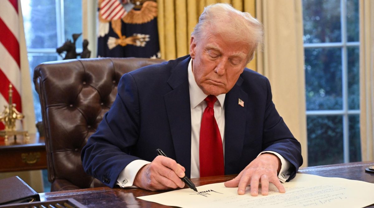 President Donald Trump signs an executive order in the Oval Office of the White House in Washington, DC, on Jan. 30, 2025. (Roberto Schmidt / AFP via Getty Images)