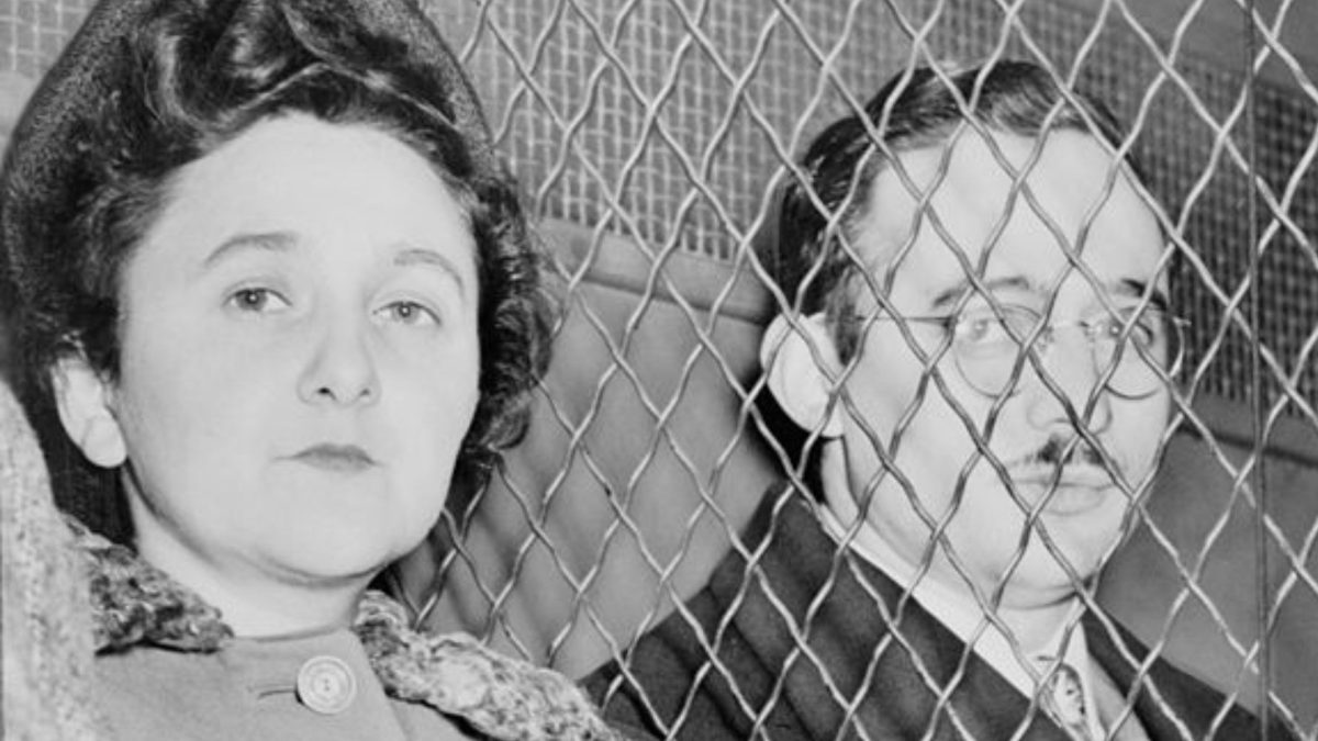 Julius and Ethel Rosenberg, separated by heavy wire screen as they leave U.S. Court House after being found guilty by jury.

