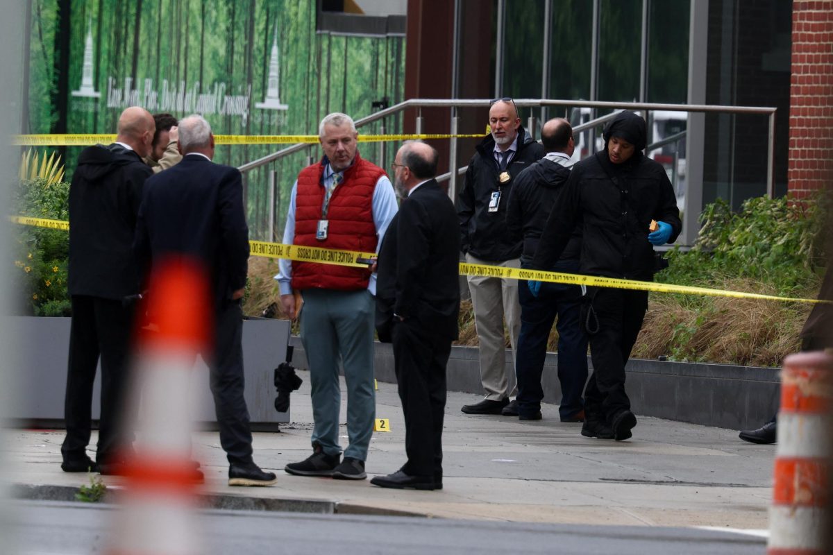 Law enforcement officials work at a crime scene where, according to the U.S. Homeland Security Secretary, two Israeli embassy staff were shot dead near the Capital Jewish Museum in Washington, D.C., U.S. May 22, 2025.  REUTERS/Evelyn Hockstein