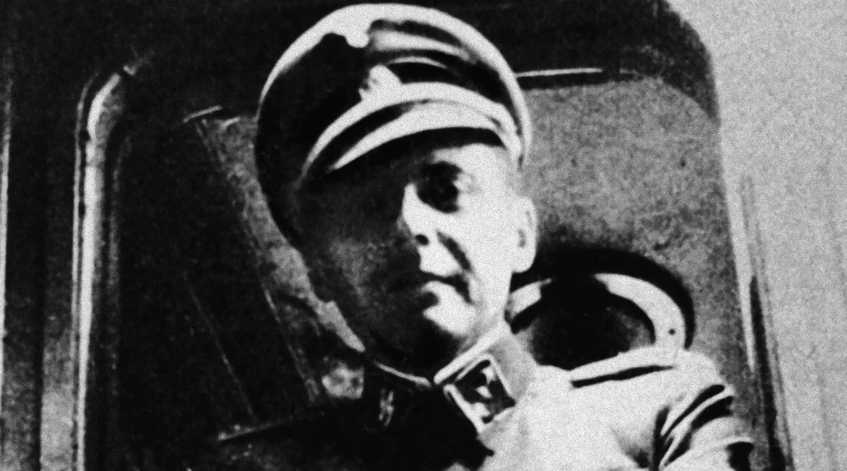 German Nazi doctor Josef Mengele standing at a train window in his SS uniform. (Hulton Archive/Getty Images)
