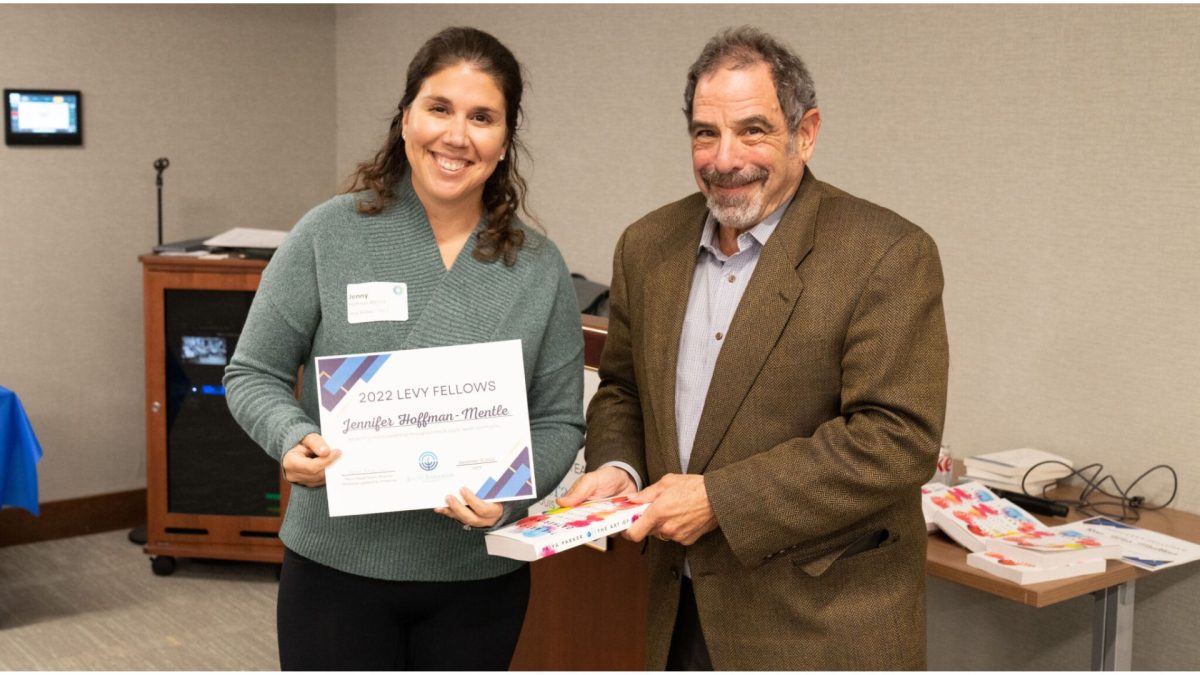 Mont Levy congratulated Jenny Hoffman-Mentle upon completion of the Levy Fellows, Jewish Federation's board development program.