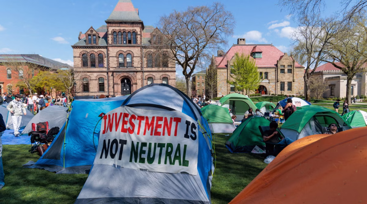 Brown University students call for divestment from their pro-Palestinian encampment on the campus' Main Green in Providence, Rhode Island, April 24, 2024. (Anibal Martel/Anadolu via Getty Images)