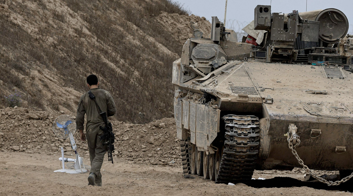 Israeli army tanks and military vehicles move in the areas near the border line of the Gaza Strip on June 23, 2025 in Israel. (Tsafrir Abayov/Anadolu via Getty Images)