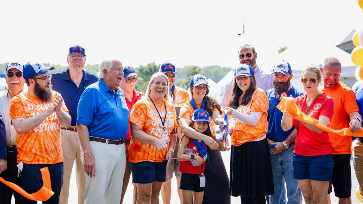: Rabbi Chaim and Bassy Landa, directors of the Chabad Jewish Center of St. Charles
County kick-off the fourth annual St. Charles Jewish Festival with a ribbon cutting flanked by
public officials and community leaders. 