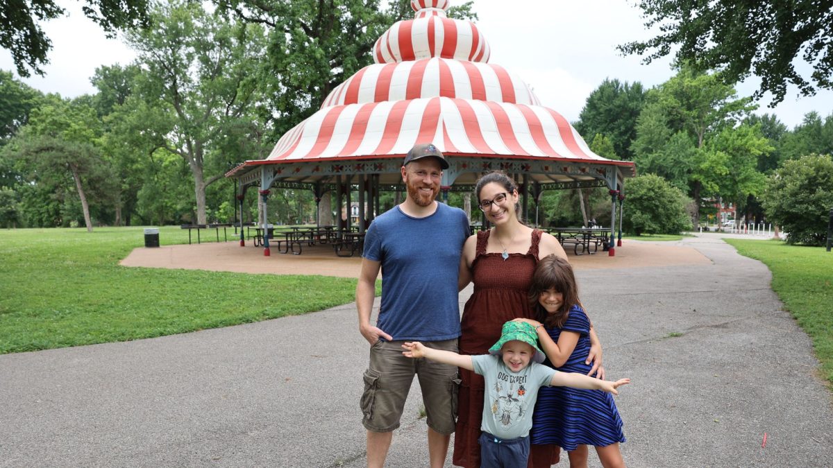 Adam Didier and Carly Ferdman with their two children in Tower Grove Park. The couple chose to live in the Shaw 
neighborhood. 