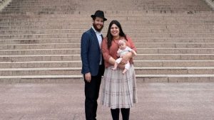 Rabbi Tzemach and Mushka Cohen, along with their baby daughter Rivka
