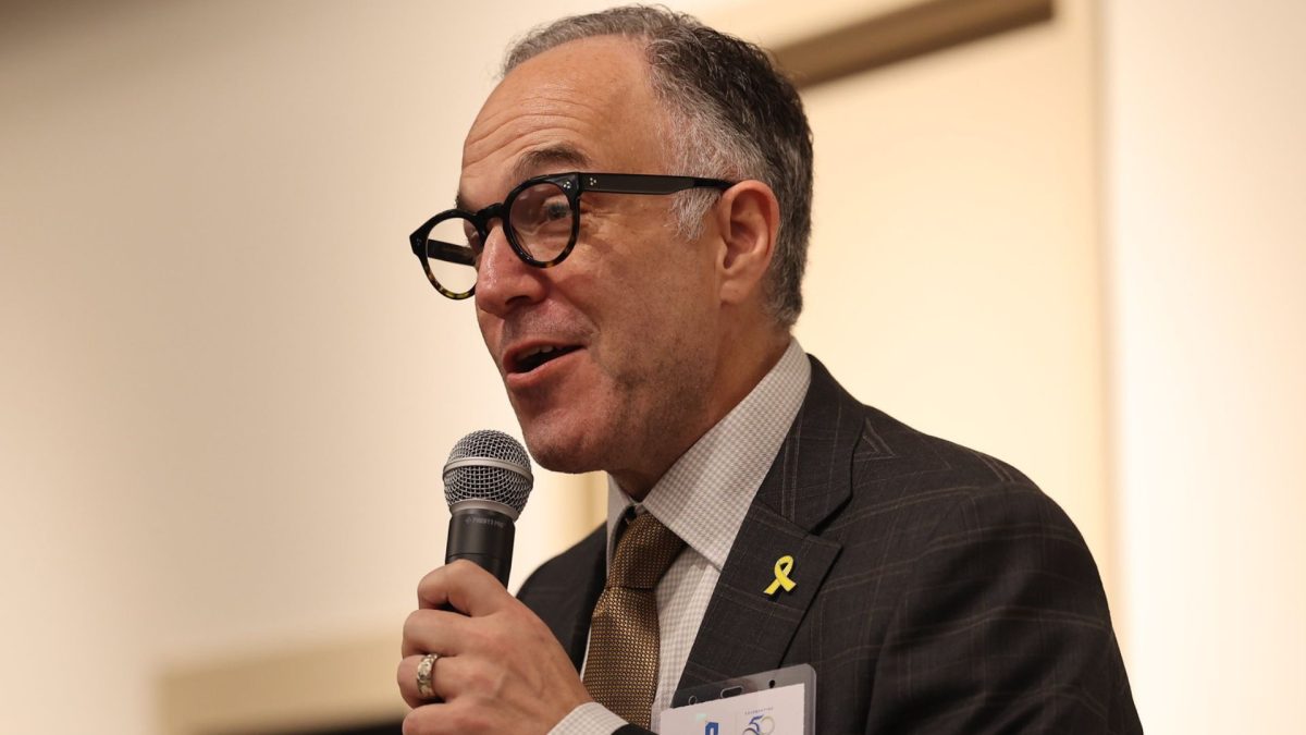 Jewish Federation of St. Louis President and CEO Danny Cohn speaks at a ribbon-cutting event at Covenant Place in March. 