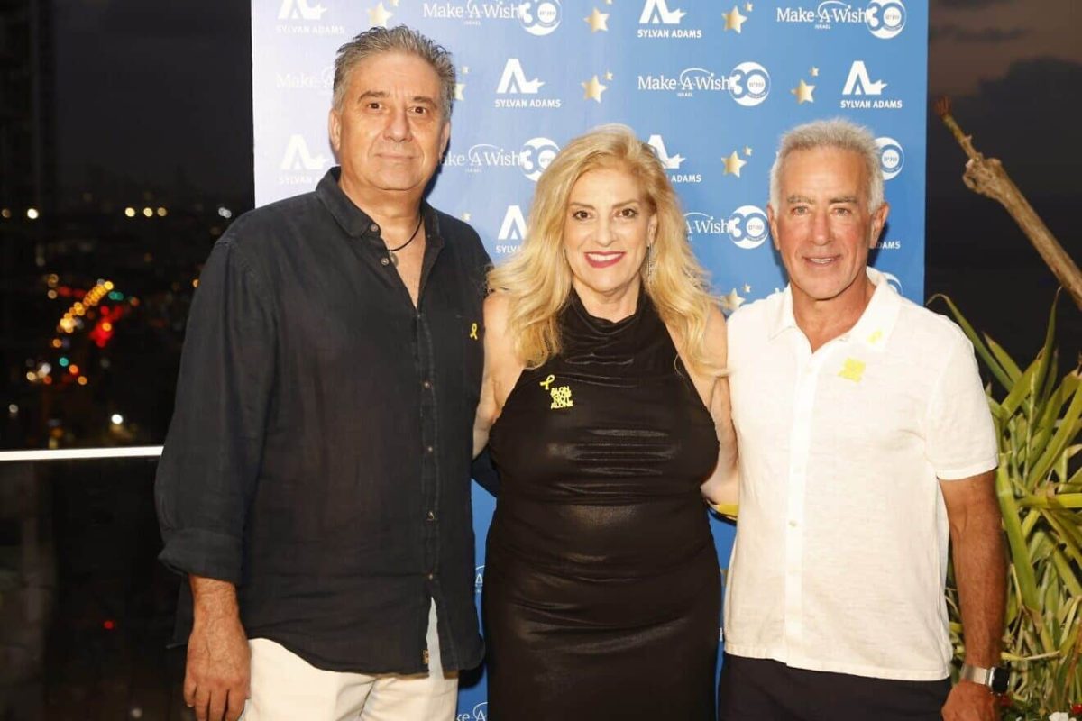 Sylvan Adams (right) hosts an event for Make-A-Wish Israel at his Tel Aviv home with organization co-founders Denise and Avi Bar-Aharon. Credit: @lans production, Aug. 27, 2025.