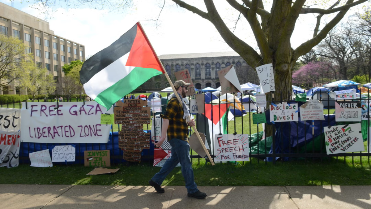 Banners hanging from the fence outside Northwestern University during a pro-Palestinian protest, Evanston, Illinois, April 27, 2024. (Jacek Boczarski/Anadolu via Getty Images)