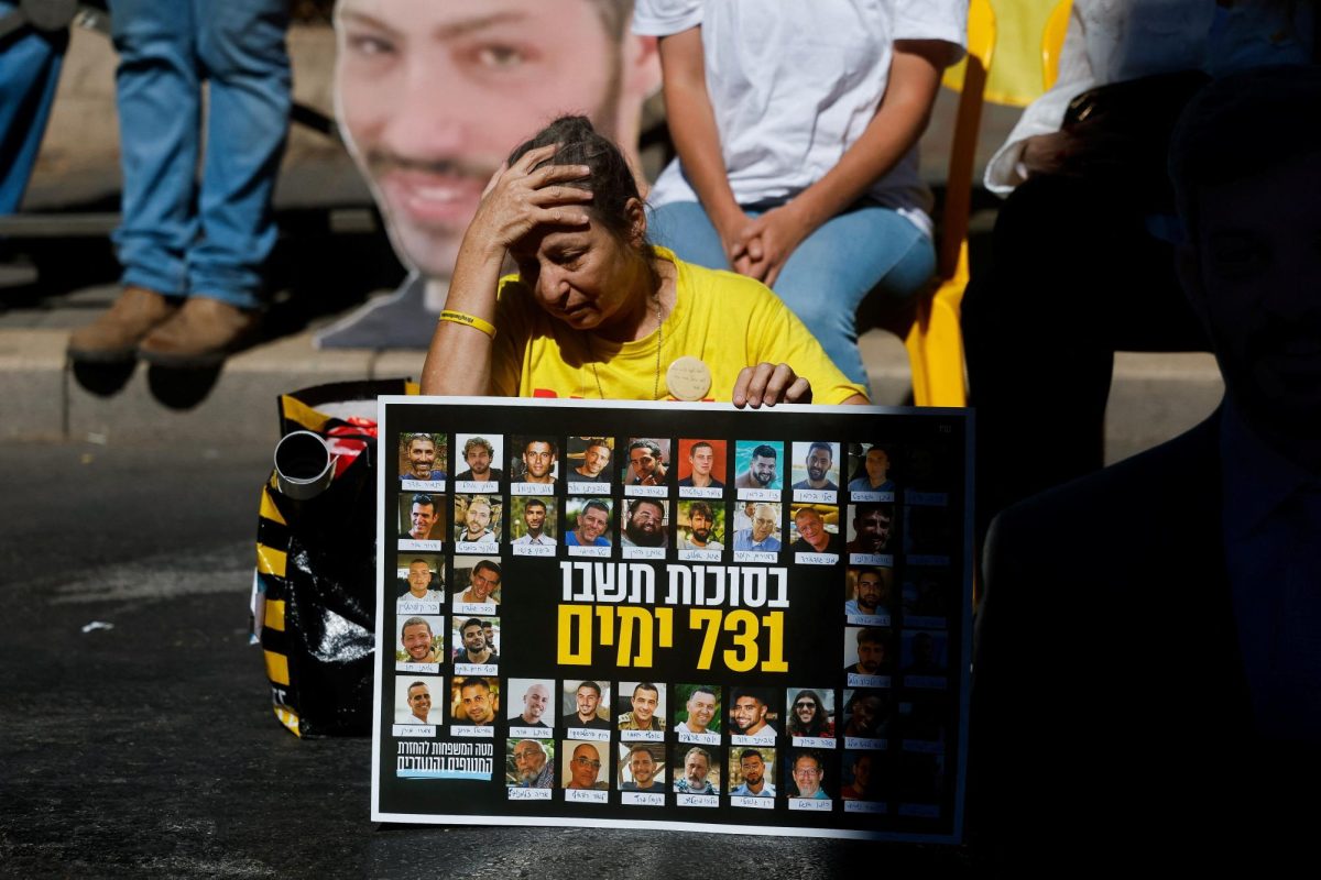 A woman reacts as families of Israeli hostages and supporters protest outside Israeli Prime Minister Benjamin Netanyahu's residence, marking the two-year anniversary of the deadly October 7, 2023 attack on Israel by Hamas from Gaza, in Jerusalem, October 7, 2025. REUTERS/Ammar Awad     TPX IMAGES OF THE DAY