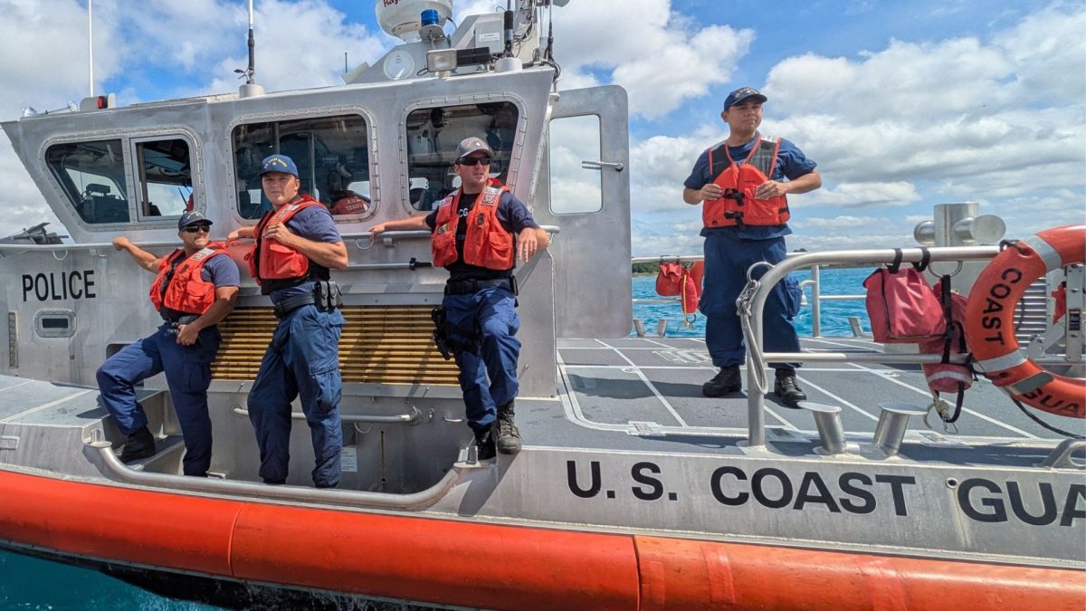 U.S. Coast Guard. Maritime Enforcement Specialist Kevin Coletti scans the horizon for anyone in need of help during the Port Huron Float Down.




