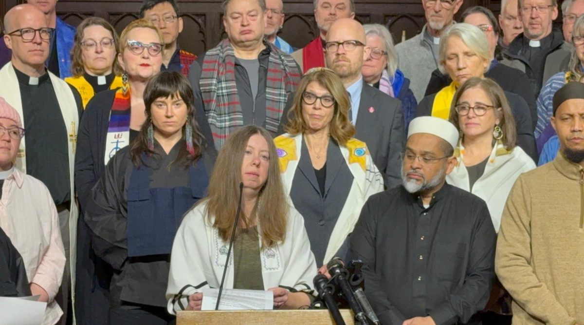 Rabbi Tamar Magill-Grimm, of the Conservative Beth Jacob Congregation in Mendota Heights, Minnesota, speaks out with other faith leaders against Immigrations and Customs Enforcement operations in the Twin Cities at a press conference at a Lutheran church in St. Paul, Jan. 20, 2026. Local cantors Tamar Havilio and Rachel Stock Spilker are behind Magill-Grimm to the right. (Courtesy of TC Jewfolk)