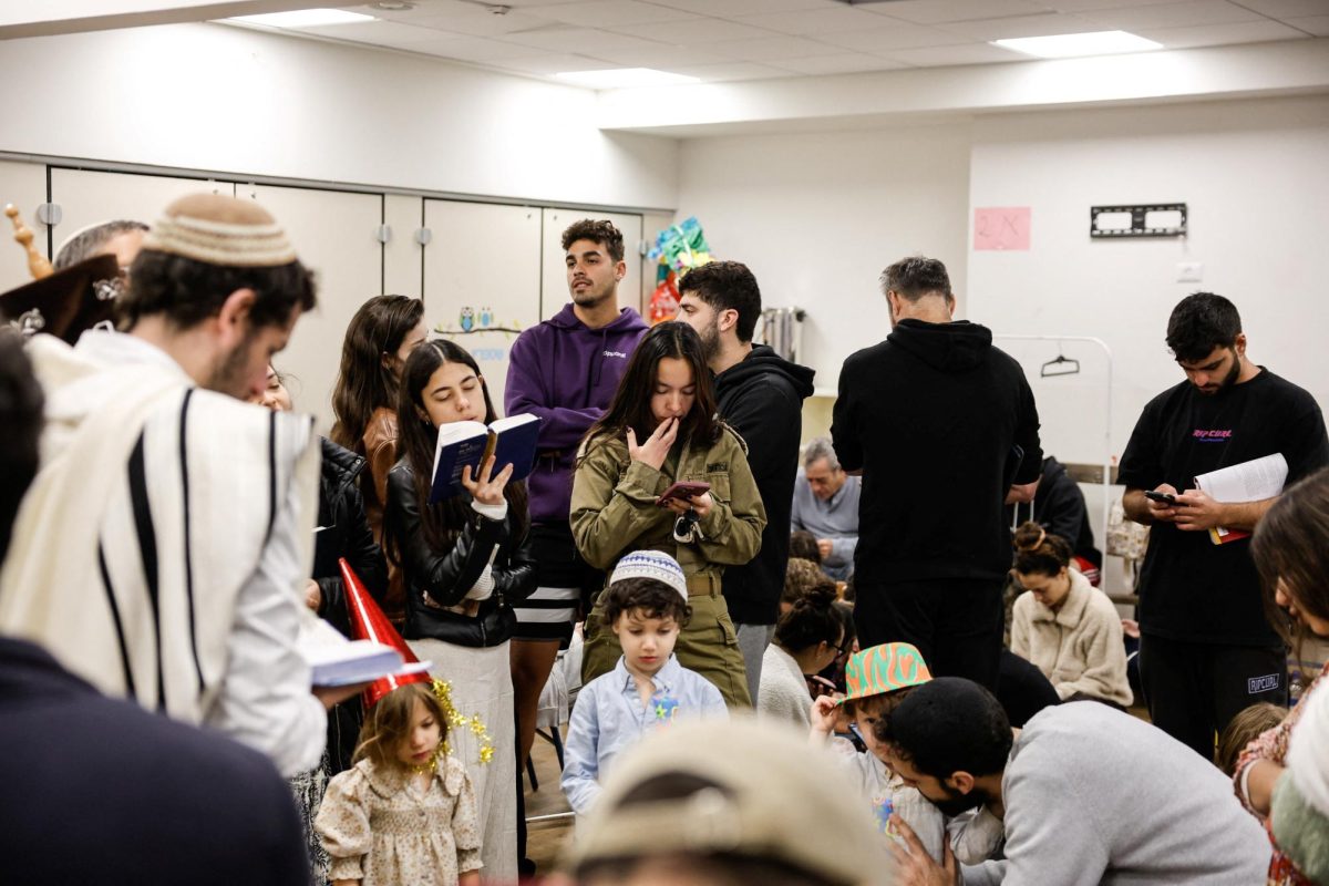 Israelis gather in a bomb shelter, after missiles were launched towards Israel from Iran following strikes by Israel and the U.S. on Iran, in Tel Aviv, Israel February 28, 2026. REUTERS/Tomer Appelbaum