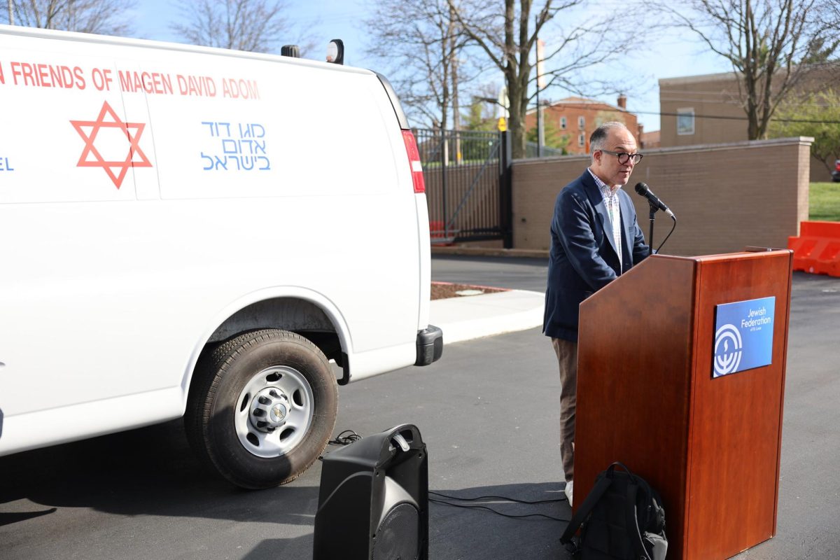 Jewish Federation President and CEO Danny Cohn speaks at the dedication event in front of the Kaplan Feldman Complex. 