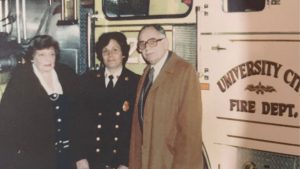 Betty Bortnick-Schneider (center), shown here with her parents, 
became University City’s first 
female firefighter. She later became the first woman to make captain in the department.