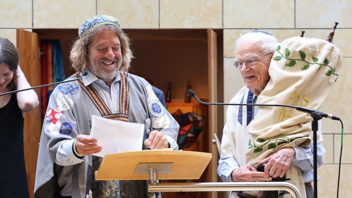 Rabbi Randy Fleisher speaks during a recent bar mitzvah ceremony at Central Reform Congregation. The words are those of Dr. Ray Slavin, who celebrated his third bar mitzvah June 27.